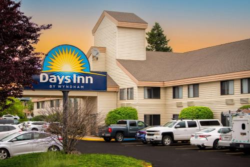 a days inn sign in front of a parking lot at Days Inn by Wyndham Coeur d'Alene in Coeur d'Alene