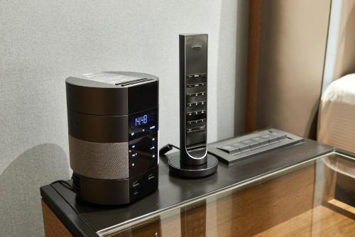 a coffee maker and keyboard on a table in a hotel room at K Hotel Taipei Nanjing in Taipei