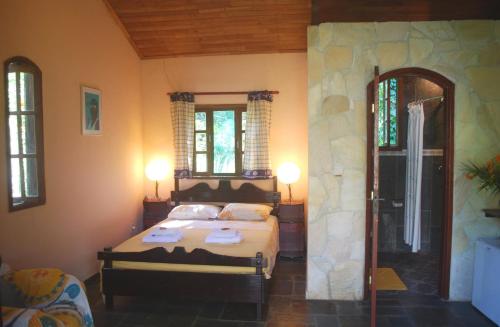 Giường trong phòng chung tại Hotel Eco Sítio Nosso Paraíso