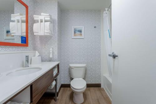 a bathroom with a white toilet and a sink at Hampton Inn & Suites - Orange Beach in Orange Beach