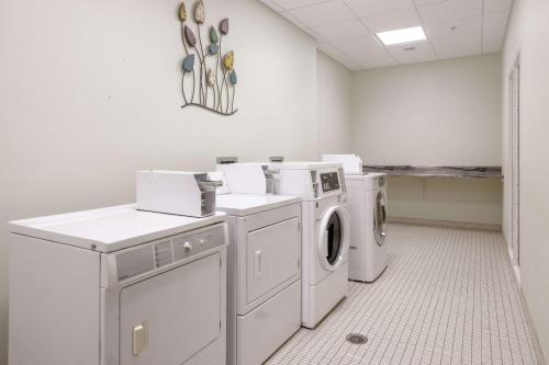 a laundry room with a washer and dryer at Hampton Inn & Suites - Orange Beach in Orange Beach