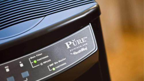 a close up of a remote control on a microwave at Embassy Suites by Hilton Norman Hotel & Conference Center in Norman