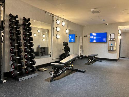 a fitness room with two treadmills and a gym at Sandman Signature Glasgow Hotel in Glasgow