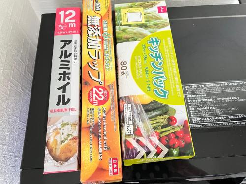 two boxes of food are sitting on a shelf at Housegreen201 in Tokyo