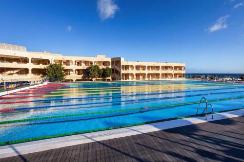 a large swimming pool in front of a building at Barceló Lanzarote Active Resort in Costa Teguise