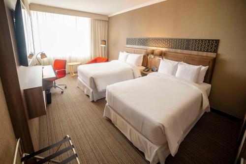 Ένα ή περισσότερα κρεβάτια σε δωμάτιο στο Doubletree By Hilton Trujillo