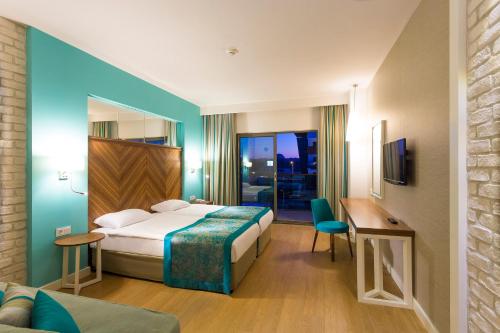 Postel nebo postele na pokoji v ubytování Hotel Terrace Beach Resort All Inclusive