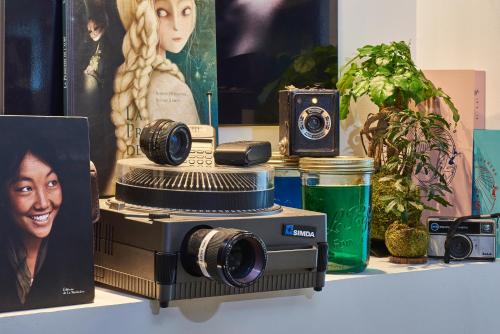 a camera sitting on a table with other items at Novotel Paris Rueil Malmaison in Rueil-Malmaison