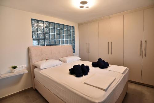 Postel nebo postele na pokoji v ubytování Good Vibes Suite