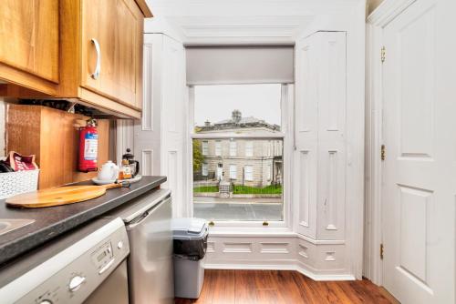 a kitchen with a window and a counter top at Flat 4, 2 Victoria Street in Armagh
