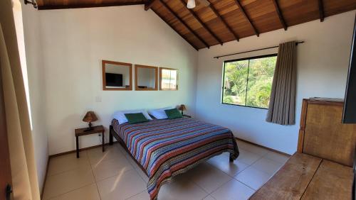 Ένα ή περισσότερα κρεβάτια σε δωμάτιο στο Buzios casa n#5