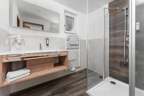 a bathroom with a sink and a shower at Haus Margret in Sankt Leonhard im Pitztal