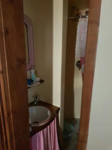 a bathroom with a sink and a mirror at il salotto dei calanchi in Civita di Bagnoregio