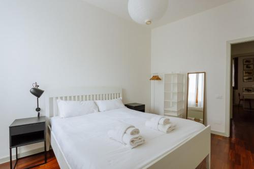 En eller flere senge i et værelse på Yourbanflat Vintage