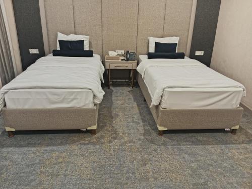 Säng eller sängar i ett rum på Darin Plaza Hotel
