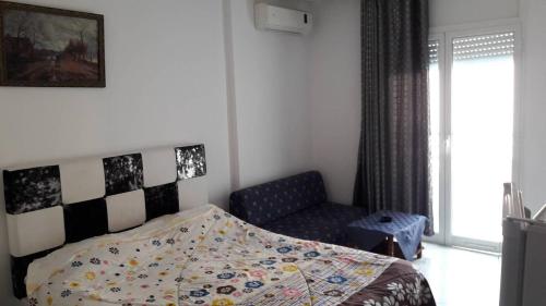 Postel nebo postele na pokoji v ubytování NEFISSA Résidence