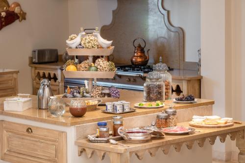 a kitchen with a table with food on it at Domaine de la Blonnerie in Feings
