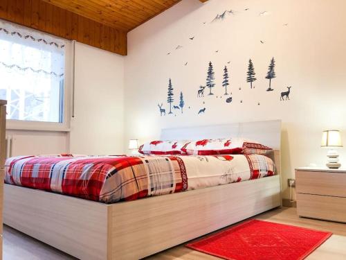 Ένα ή περισσότερα κρεβάτια σε δωμάτιο στο Spazioso Angolo di Paradiso - Residence Erika (TN)