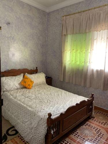 מיטה או מיטות בחדר ב-Logement entier appartement Chez Mehdi