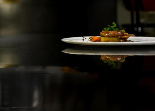 a plate of food sitting on a table at Hotel Casa Scaligeri in Sirmione