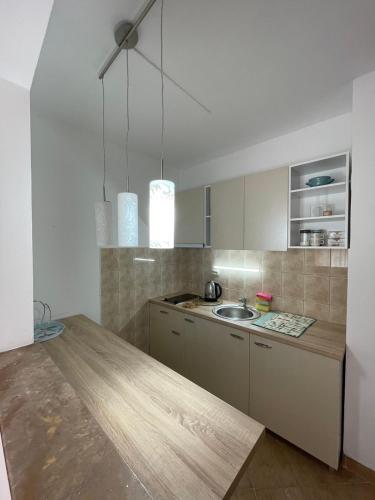 a kitchen with a counter and a sink in it at Hana Apartment Ohrid in Ohrid