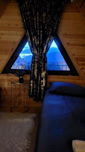Postel nebo postele na pokoji v ubytování MTISGULI Cottages