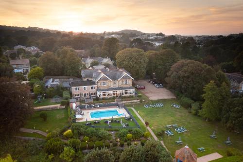 an aerial view of a mansion with a swimming pool at Luccombe Manor Country House Hotel in Shanklin
