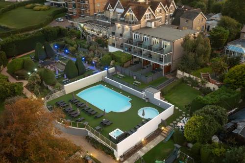 an aerial view of a mansion with a swimming pool at Luccombe Manor Country House Hotel in Shanklin