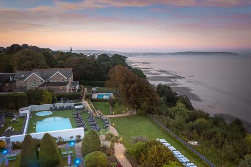 an aerial view of a house and the water at Luccombe Manor Country House Hotel in Shanklin