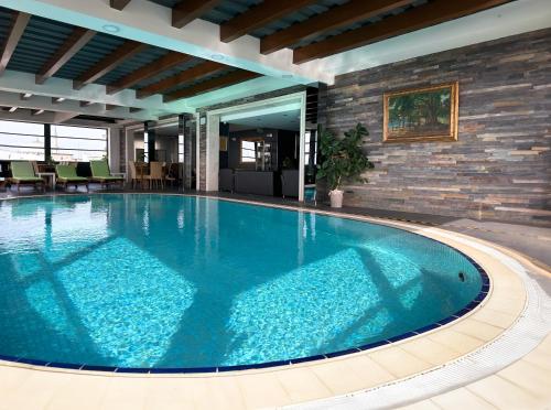 a large swimming pool in the middle of a building at AHC Old City Hotel in Istanbul