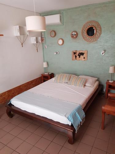 A bed or beds in a room at 1- VACOA - CHAMBRE 1 - Rdc G