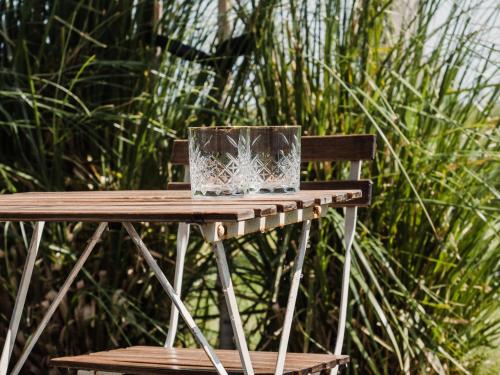 a wooden table with a box on top of it at Op Oost Boutique hotel & Restaurant het Kook Atelier in Oosterend