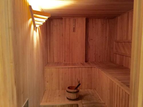 a wooden sauna with a bucket in it at Purobaires Hotel Boutique in Buenos Aires