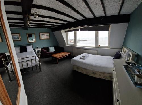 Voodi või voodid majutusasutuse The Mariners House toas