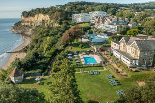 an aerial view of a house and the ocean at Luccombe Manor Country House Hotel in Shanklin