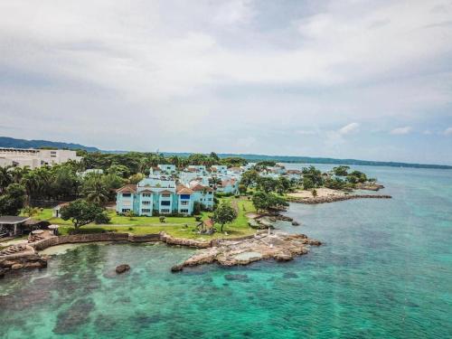 an aerial view of a house on a island in the water at Paradise Point Villa Negril in Orange Bay