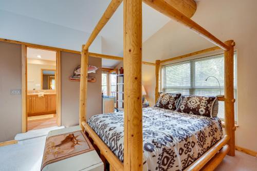 a bedroom with a four poster bed in a house at Rustic Ward Retreat with Deck and Mountain Views! in Ward