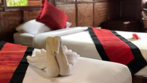 Voodi või voodid majutusasutuse Mekong Riverside Lodge toas