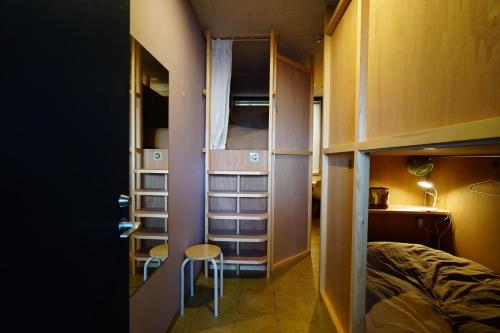 a small room with a bed and a chair in it at La Union - Vacation STAY 99795v in Fukushima