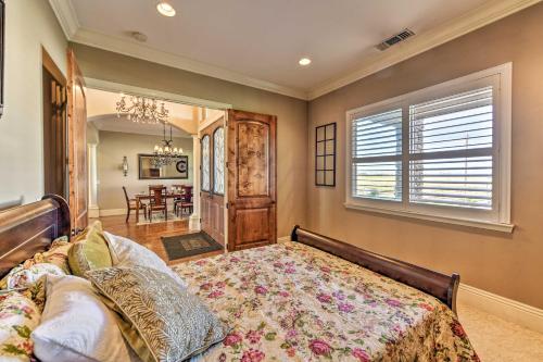 a bedroom with a bed and a dining room at Elk Grove Getaway with Saltwater Pool Near Wineries! in Elk Grove