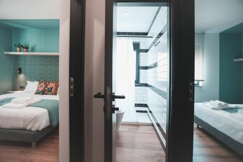 a bedroom with a bed and a glass door at Alma Candida 16 in Ganfei