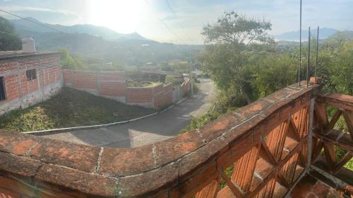a brick wall with a view of a street at Casa Gutiérrez in Teotitlán del Valle