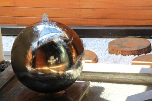 a metal ball sitting on top of a table at D'Andrea Mare Hotel in Ialyssos