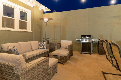 a living room with couches and chairs and a table at Plush 2-bed apt in Riverside Heights! in Reno