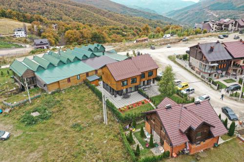 an aerial view of a large house in a village at Moments Villas Premium, Prevalle in Prizren