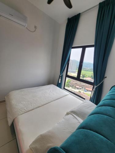 Una cama o camas en una habitación de The Horizon - Ipoh