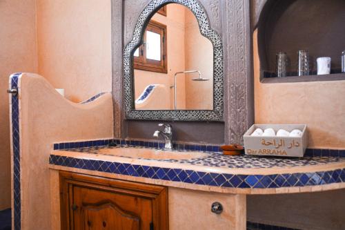 a bathroom with a sink and a mirror at Dar Arraha Ouirgane in Ouirgane