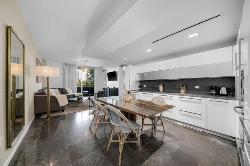 a kitchen with a table and chairs and a living room at BOULAN HOTEL MIAMI BEACH BY IMD MIAMI 1BR/1BA UNIT in Miami Beach