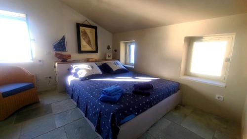 Ένα ή περισσότερα κρεβάτια σε δωμάτιο στο CABANON PETRONILLE