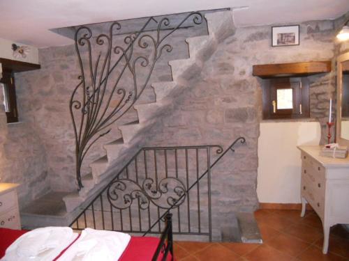 Postel nebo postele na pokoji v ubytování Torre Riva Dimora storica